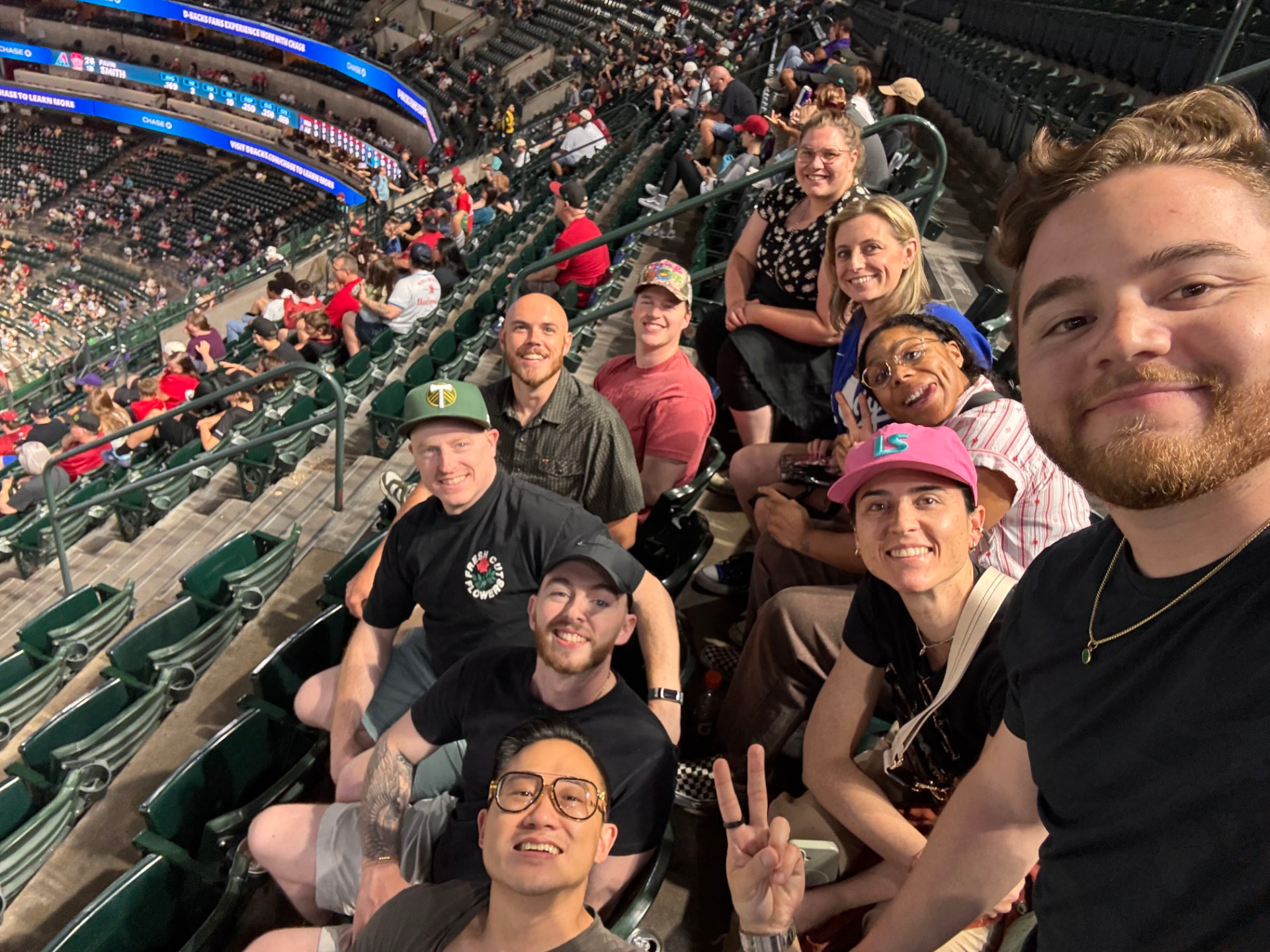 Members of the Cartograph team together at a baseball game